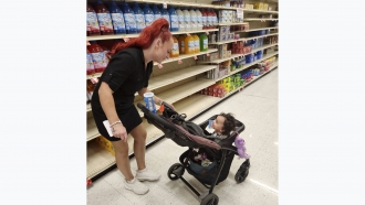 Jazmin Valentine and her baby at a supermarket