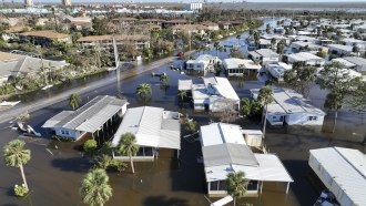 Homes are underwater after flooding from a hurricane.