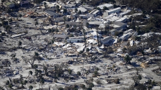 An aerial shot shows damage from Hurricane Ian on Estero Island in Fort Myers Beach, Fla.