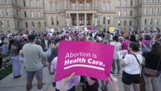 Abortion-rights protesters attend a rally outside the state capitol in Lansing, Michigan