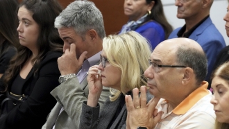 Abby Hoyer, Tom and Gena Hoyer, and Michael Schulman react during the reading of jury.