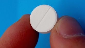 A pill is shown.