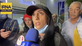 Iranian competitive climber Elnaz Rekabi speaks to journalists in Imam Khomeini International Airport in Tehran, Iran