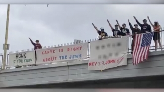 A tweet from California Rep. Karen Bass shows an antisemitic display on a Los Angeles highway overpass.