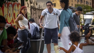 Venezuela immigrants stand in New York City.