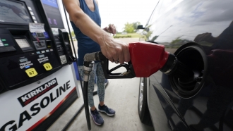 A customer pumps gas.