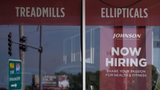 Hiring sign is displayed in Northbrook, Ill.