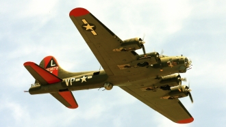 The historic military B-17 aircraft named "Texas Raiders" flies