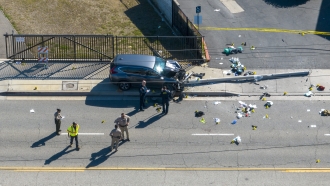 Investigators work the scene where Los Angeles County sheriff’s academy recruits were struck by a car.