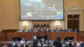 A video of President Trump's motorcade leaving the January 6th rally on the Ellipse is displayed during Jan. 6 hearing.