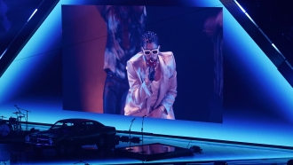 Bad Bunny appears on screen performing remotely at the MTV Video Music Awards at the Prudential Center.