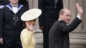 Prince William and Princess Kate wave at a crowd