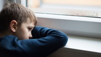 A child looks out of a window