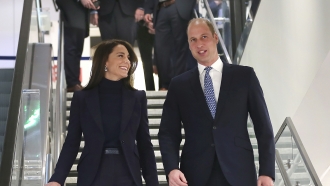 Prince William and Princess Kate wave at a crowd