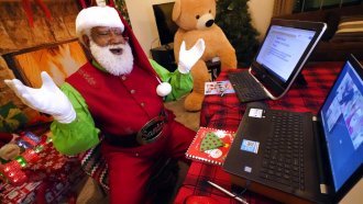 Santa chats with children in a video conference