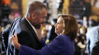 Speaker of the House Nancy Pelosi of Calif., embraces former Washington Metropolitan Police Department officer Michael Fanone