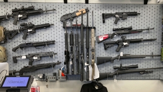 Image of firearms on display at a gun shop.