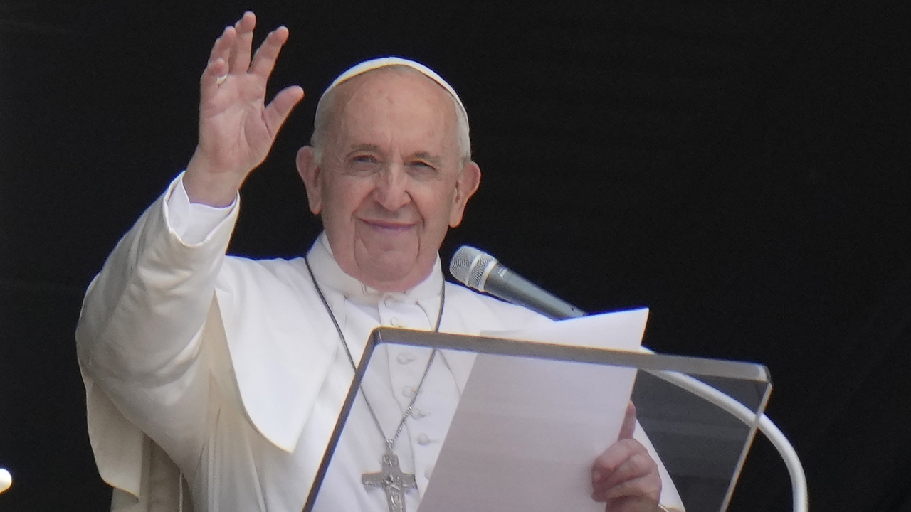 Pope Francis waves to the crowd