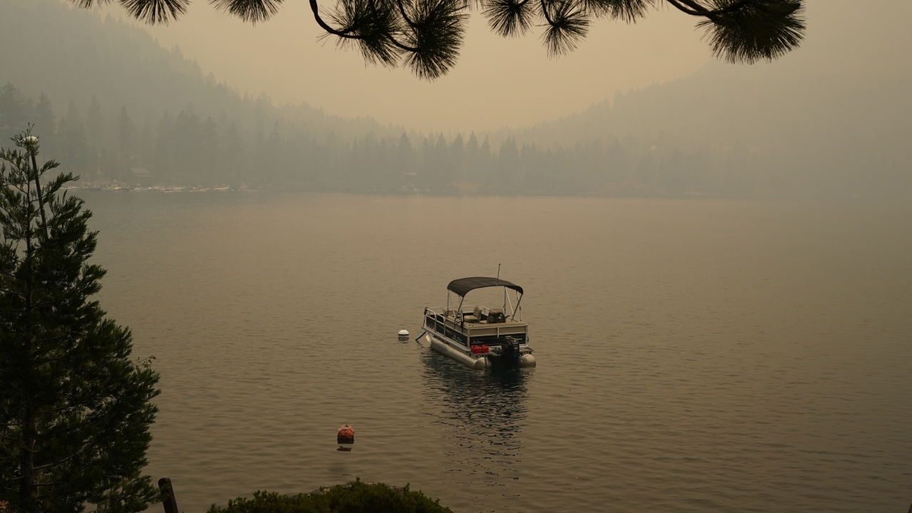 Smoke from the Caldor Fire, shrouds Fallen Leaf Lake near South Lake Tahoe in California