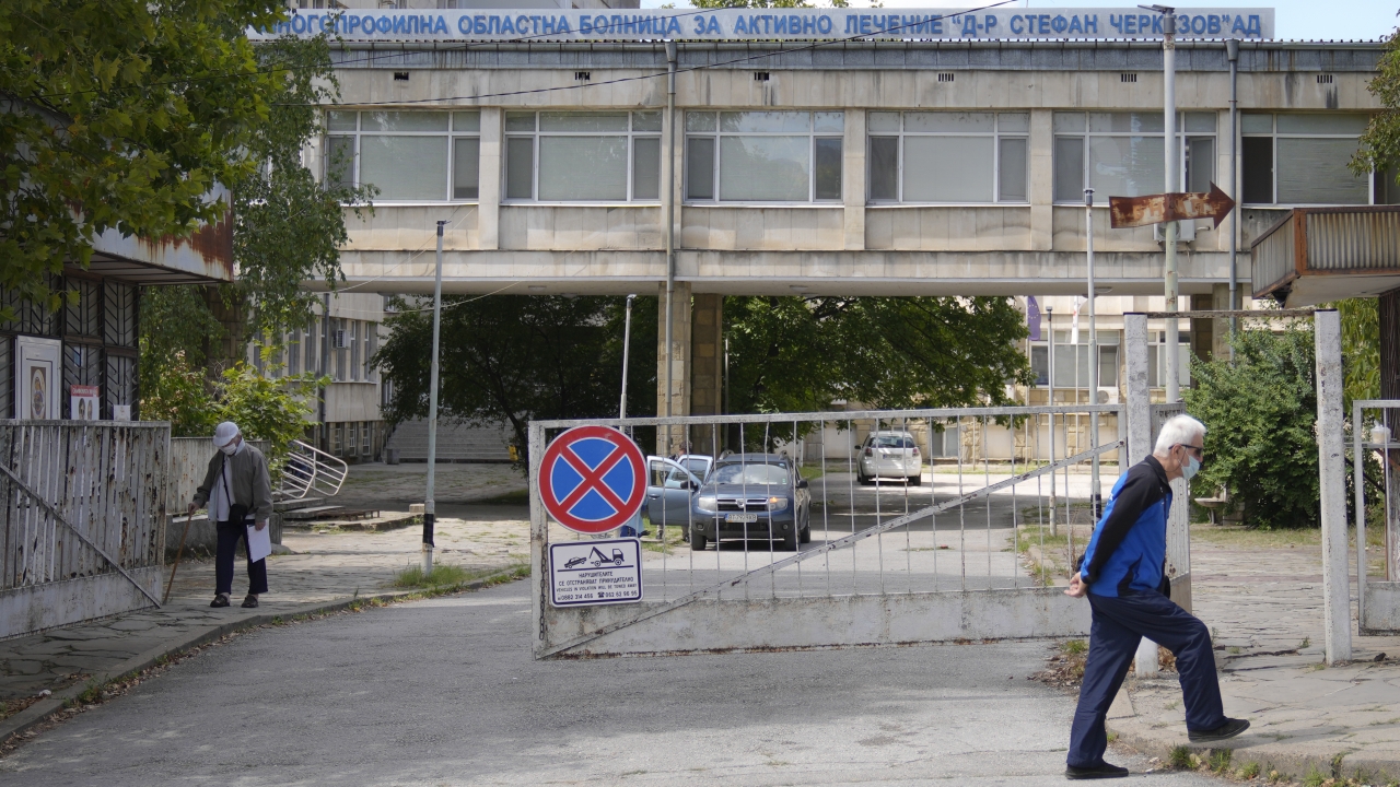 Men walk outside the state hospital in Veliko Tarnovo, Bulgaria.