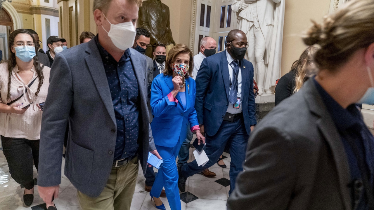 House Speaker Nancy Pelosi walks off the House floor