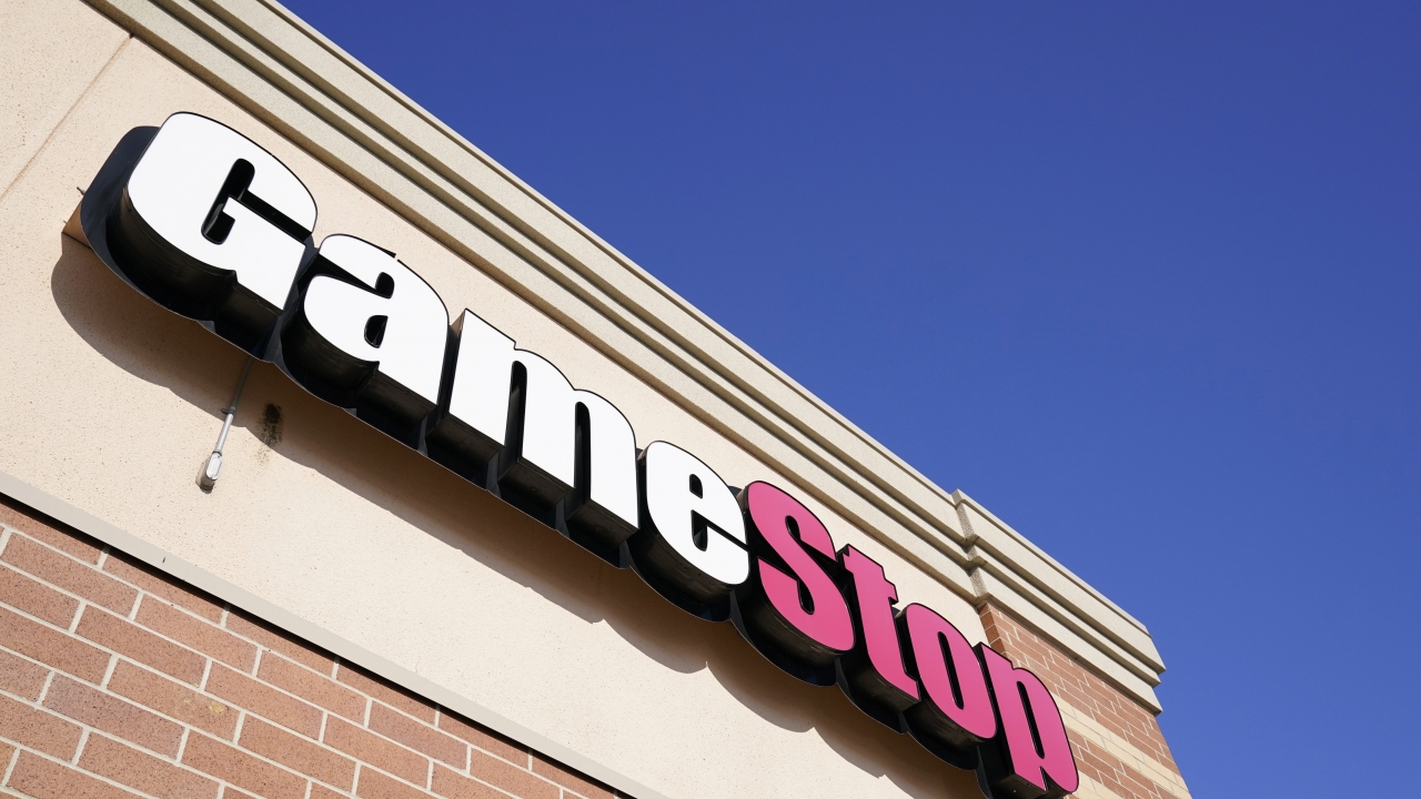 In this Thursday, Jan. 28, 2021 file photo, a GameStop sign is seen above a store, in Urbandale, Iowa.