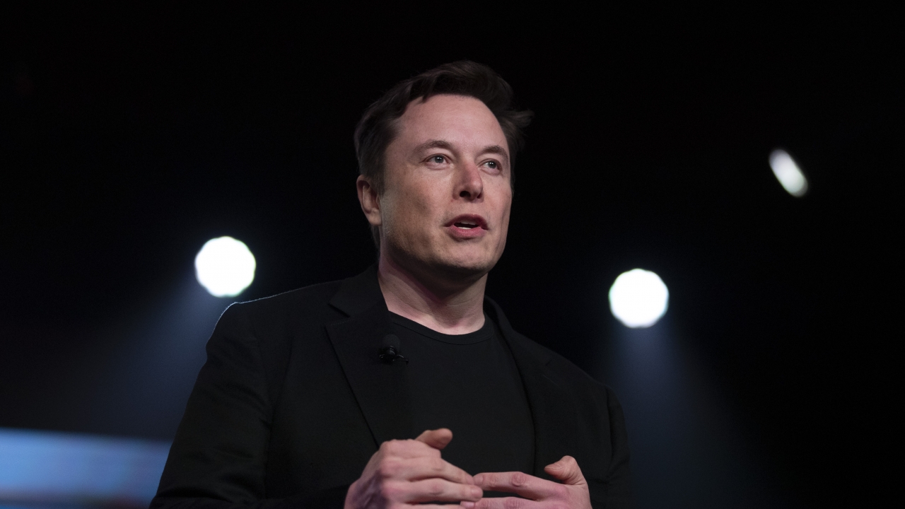 CEO Elon Musk speaking at the company's design studio.