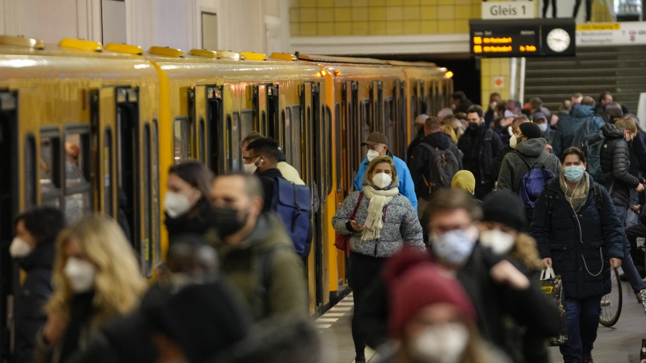 Travelers wearing face masks to protect against the coronavirus at a public transport station in Berlin, Germany.