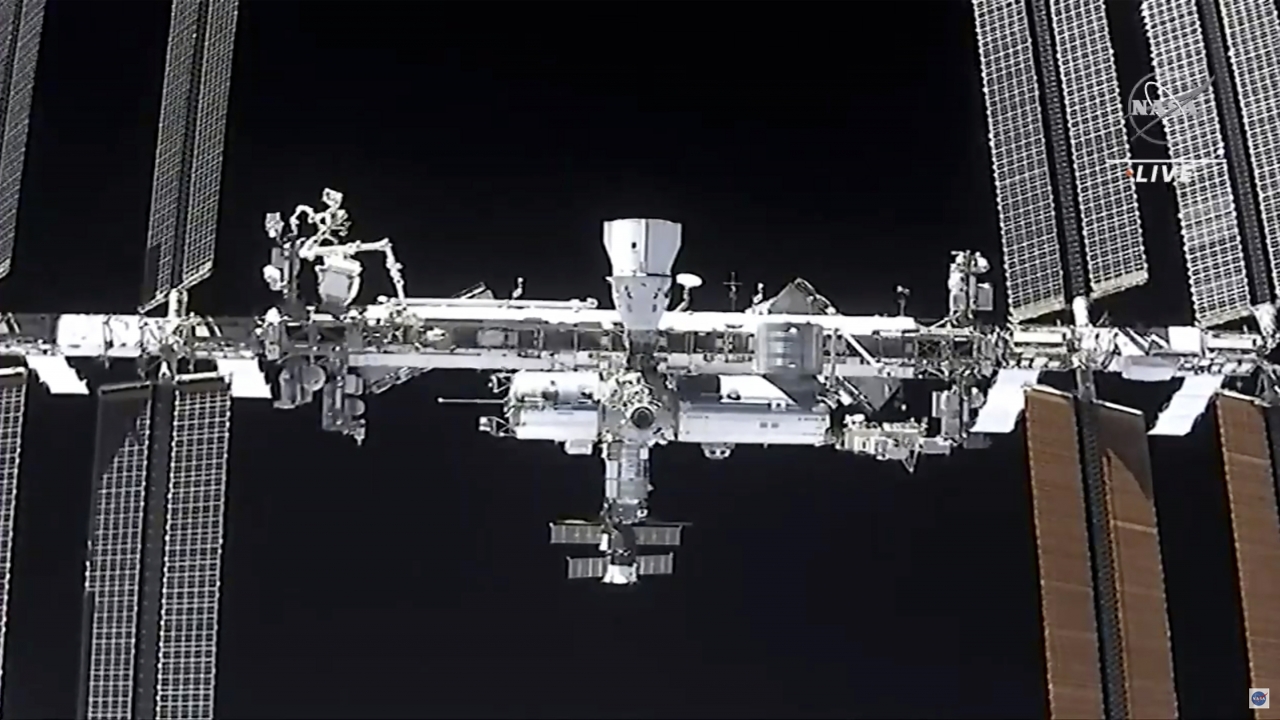 NASA TV shows the international space station from the SpaceX Crew Dragon spacecraft.