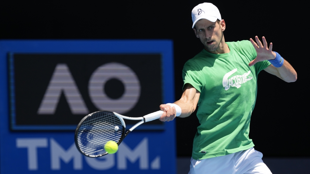 Defending men's champion Serbia's Novak Djokovic practices ahead of the Australian Open tennis championship