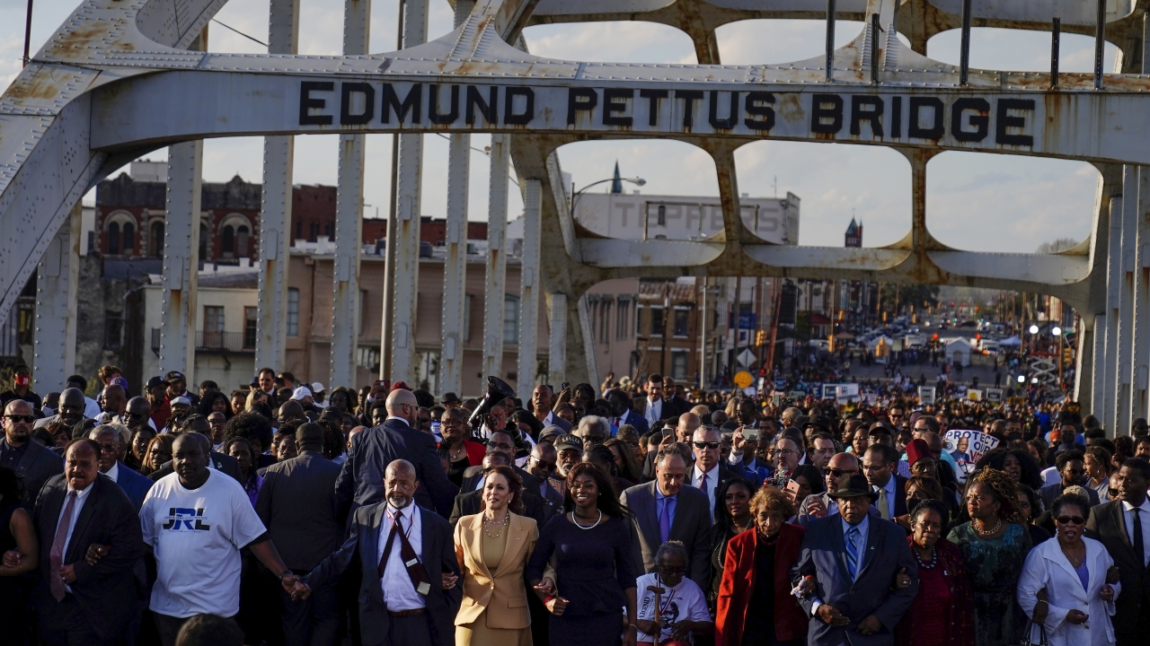 Vice President Kamala Harris marches on the Edmund Pettus Bridge after speaking in Selma, Alabama.