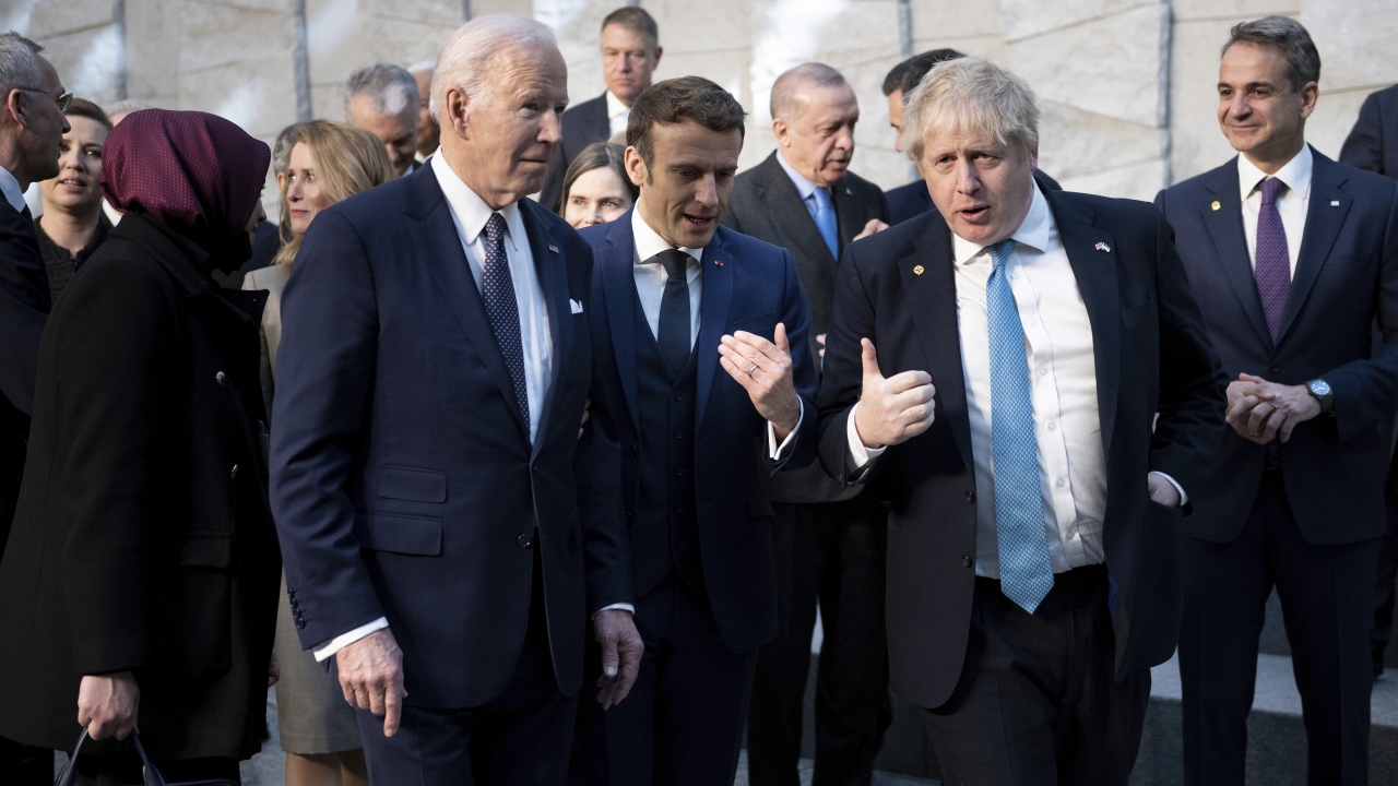 U.S. President Joe Biden, left, talks with French President Emmanuel Macron and British Prime Minister Boris Johnson.