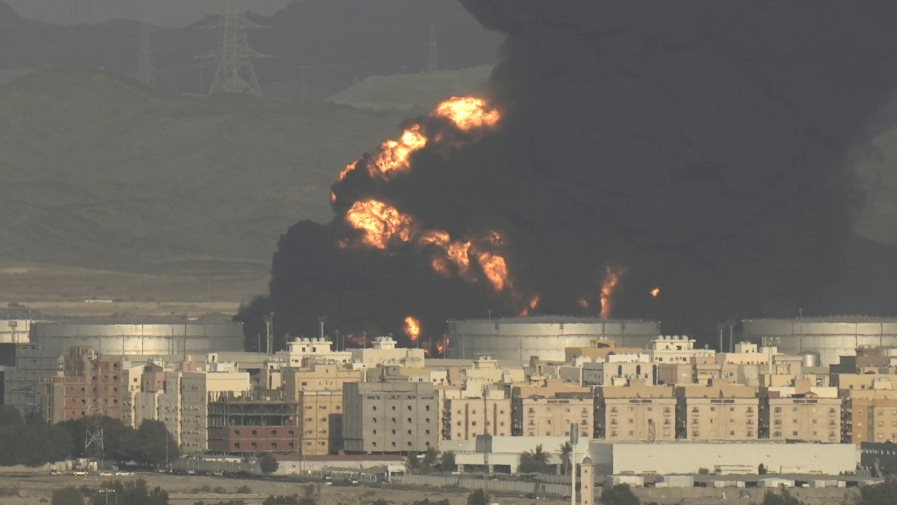 A cloud of smoke rises from a burning oil depot in Jiddah, Saudi Arabia.