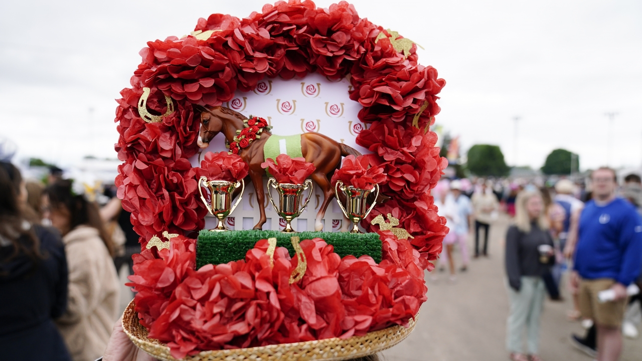 A woman wears a decorative hat at the148th running of the Kentucky Derby.