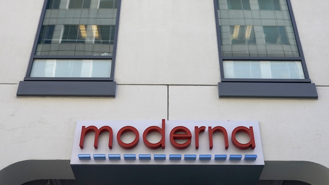 A sign for Moderna, Inc. hangs on its headquarters in Cambridge, Massachusetts