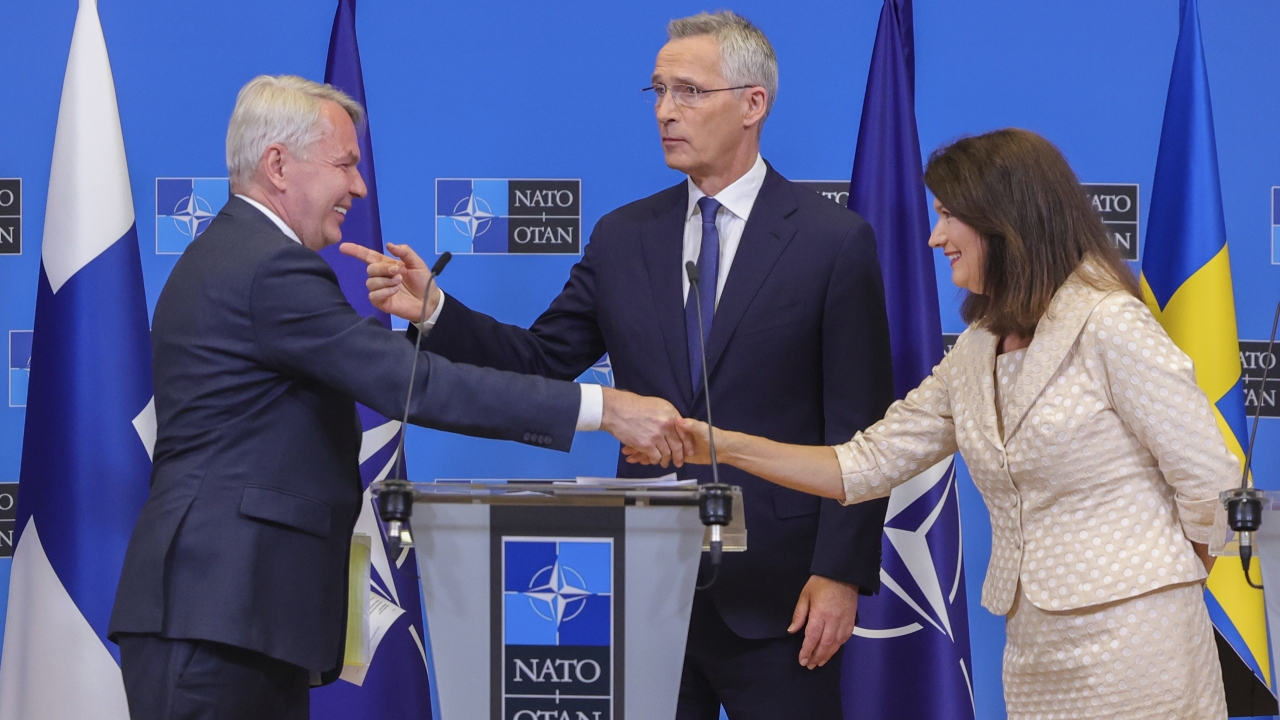 Finland's Foreign Minister Pekka Haavisto, Sweden's Foreign Minister Ann Linde and NATO Secretary General Jens Stoltenberg