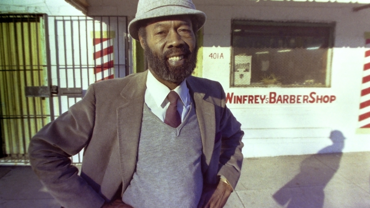 Vernon Winfrey, father of Oprah Winfrey, stands outside his barber shop in Nashville, Tenn., in 1987.