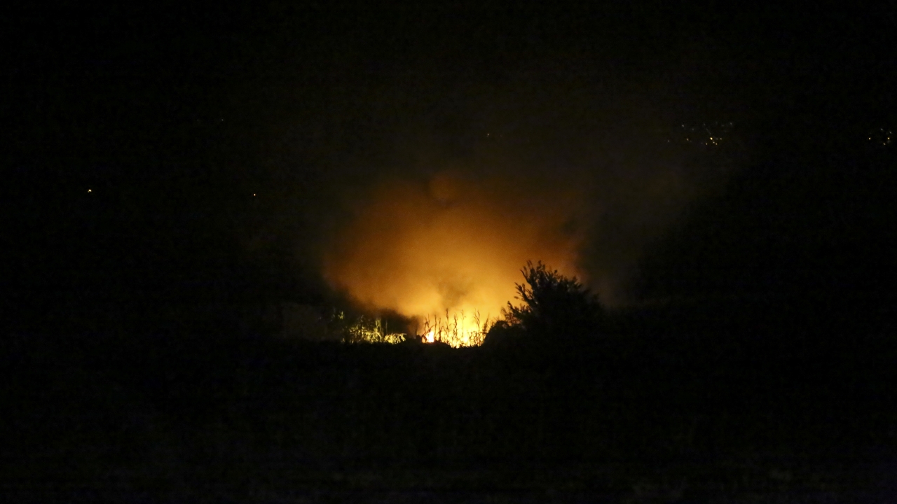 Flames are seen at the site of a plane crash, a few miles away from the city of Kavala, in northern Greece.
