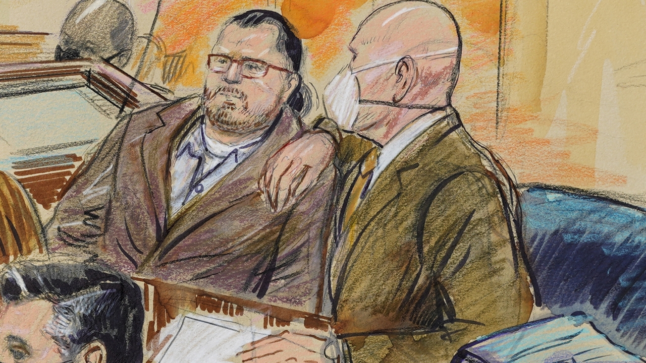 An artist sketch depicts Guy Wesley Reffitt joined by his lawyer William Welch