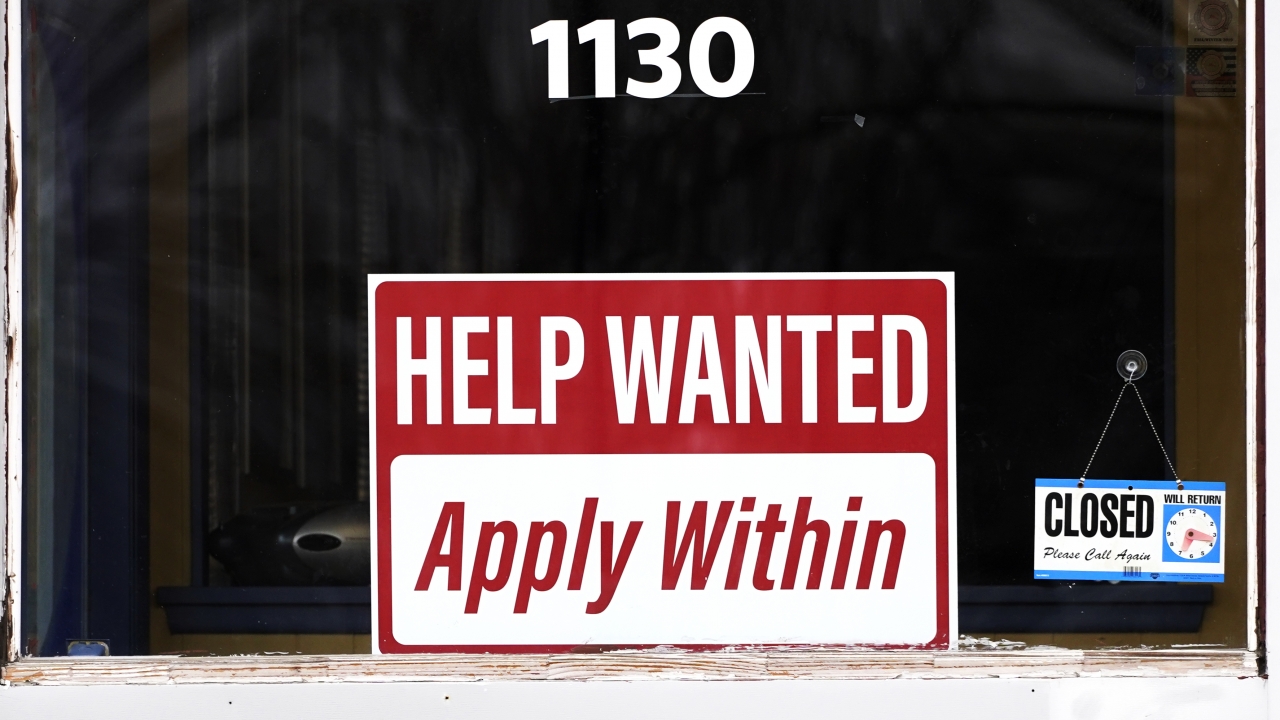 A "help wanted" sign is seen at an Allstate insurance office.
