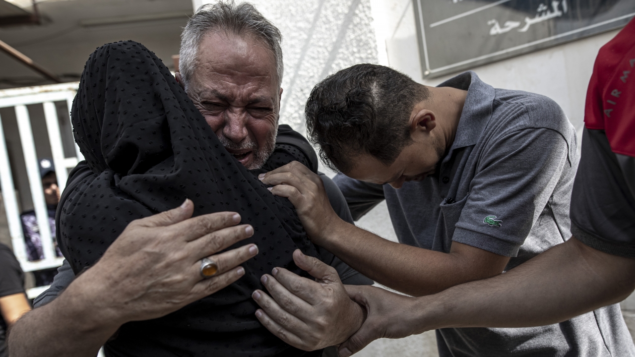 Relatives of Muhammad Hassouna, who was killed in an Israeli airstrike, mourn before his funeral.