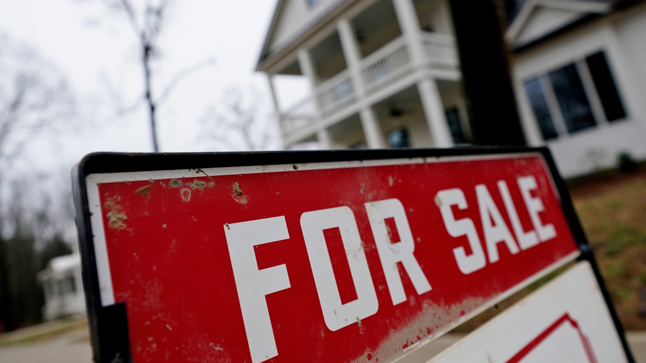 "For Sale" sign outside a home