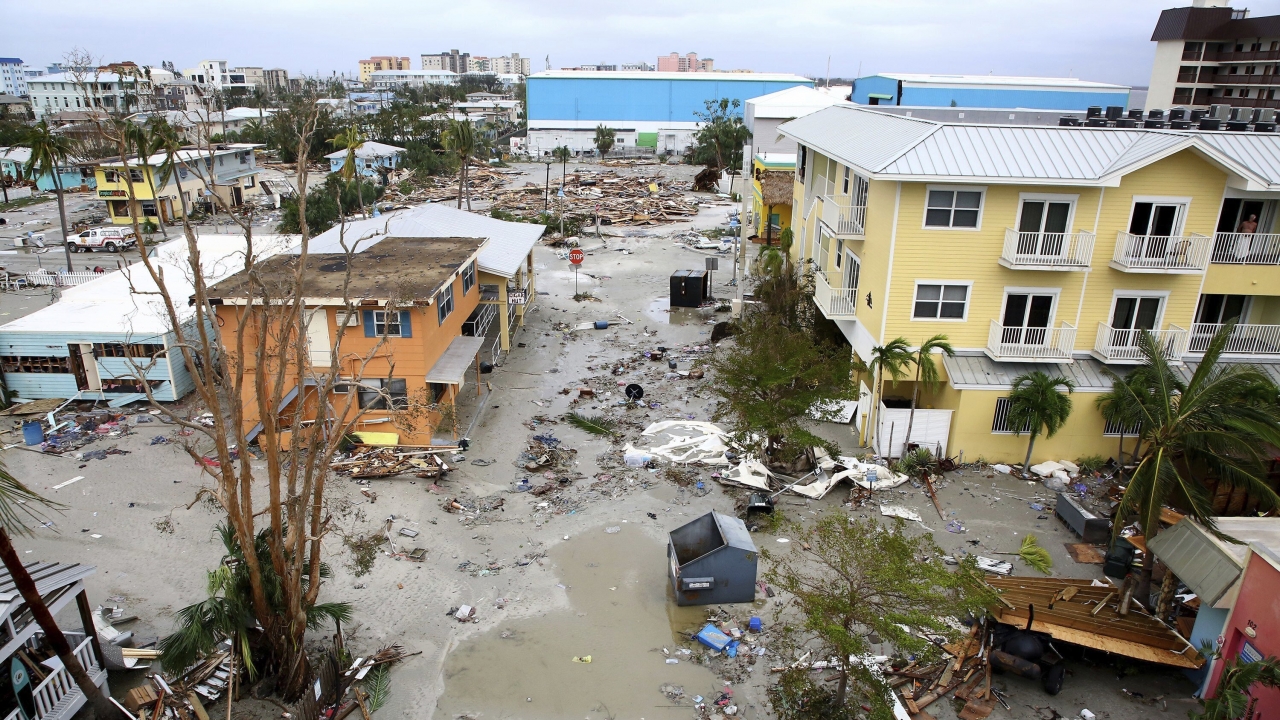 Damaged homes and businesses are seen in Fort Myers Beach, Fla.