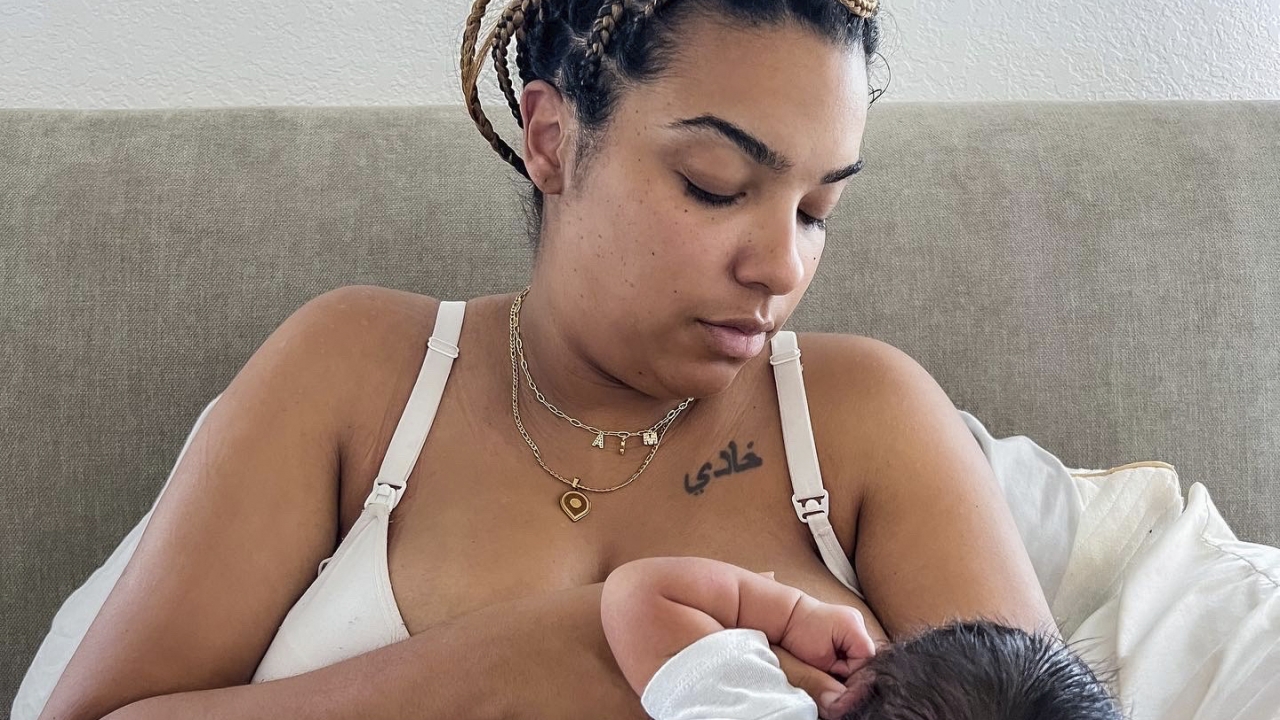 Jade Godbolt nurses her newborn child at their Dallas-area home after giving birth