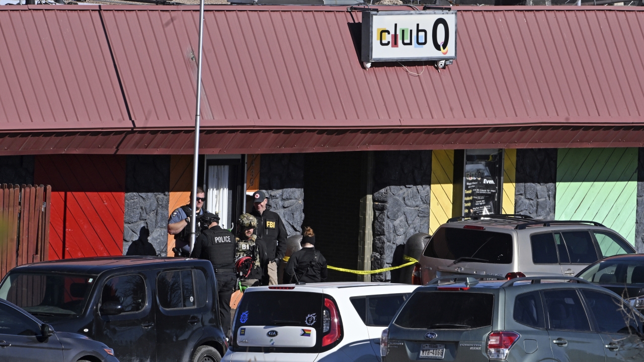 The FBI and others investigate the scene of a shooting at Club Q.
