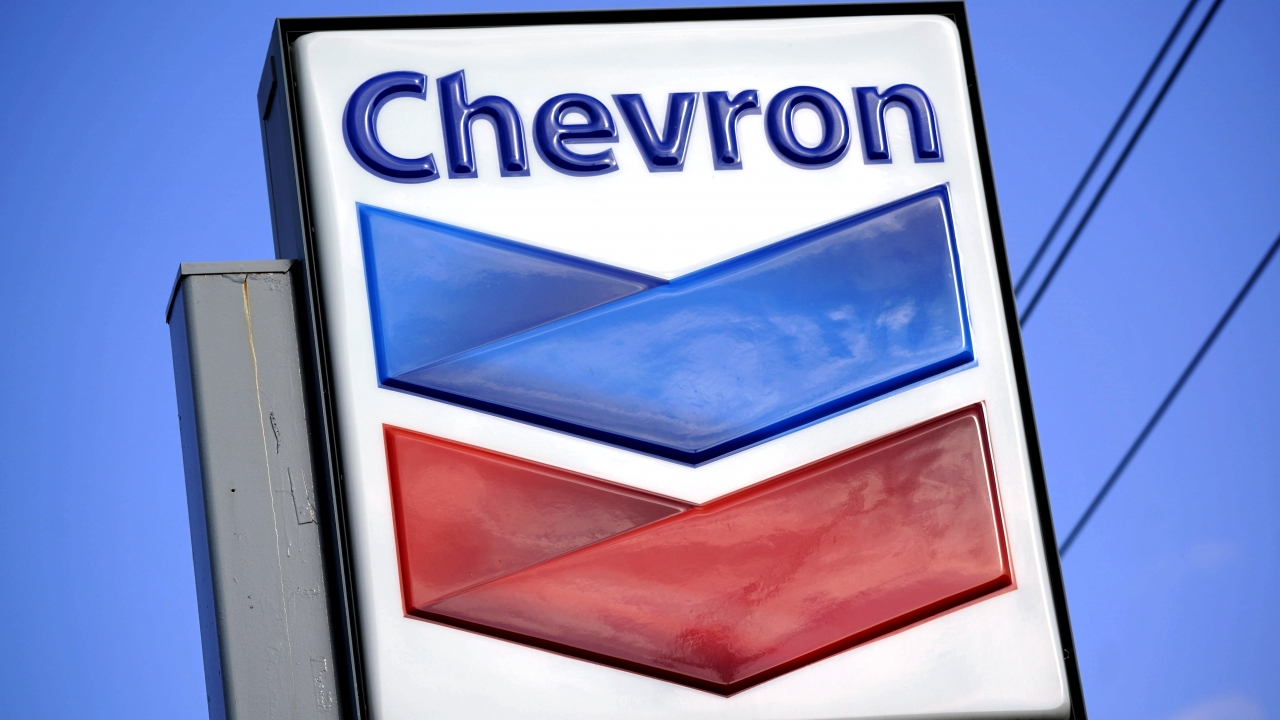 A Chevron sign is displayed outside one of the company's gas stations.
